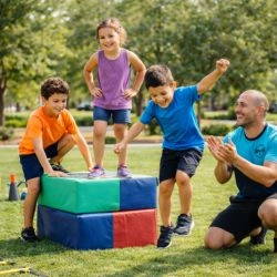 Movement - youth jumping off soft platform with trainer